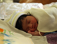 A healthy newborn sleeping.
